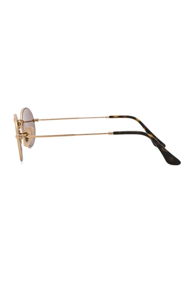 Shop Ray Ban Oval Flat Sunglasses In Gold Flash