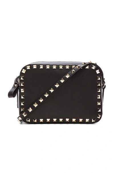 Shop Valentino Rockstud Crossbody Bag In Black