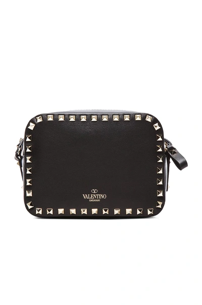 Shop Valentino Rockstud Crossbody Bag In Black