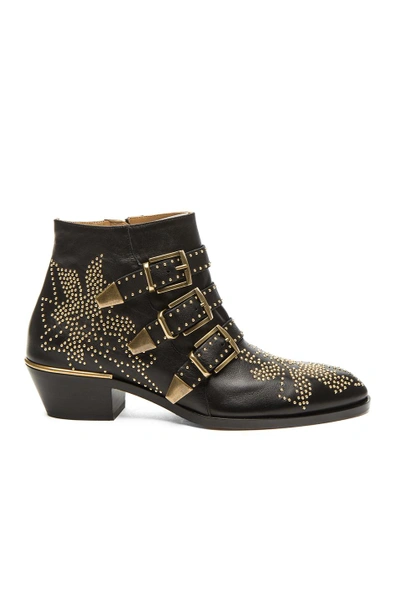 Shop Chloé Susanna Leather Studded Booties In Black & Gold