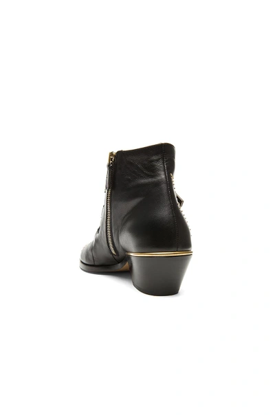 Shop Chloé Susanna Leather Studded Booties In Black & Gold