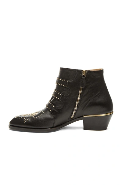 Shop Chloé Susanna Leather Studded Booties In Black & Gold