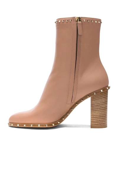 Shop Valentino Rockstud Trim Leather Booties In Neutrals