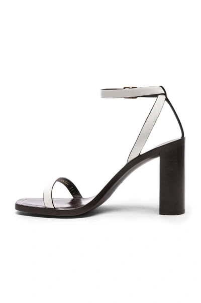 Shop Saint Laurent Leather Loulou Ankle Strap Sandals In White