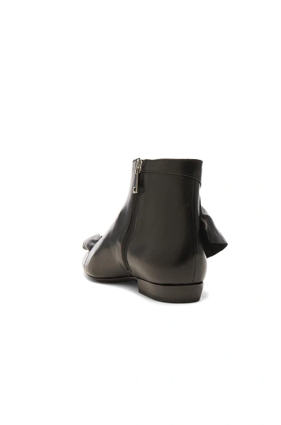 Shop Jw Anderson Leather Ruffle Booties In Black