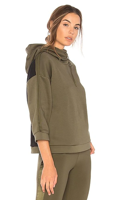 Shop Puma Funnel Neck Hoodie In Olive