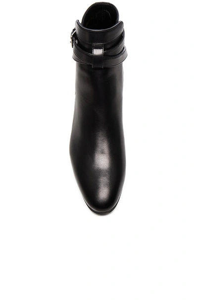 Shop Saint Laurent Leather Blake Buckle Boots In Black