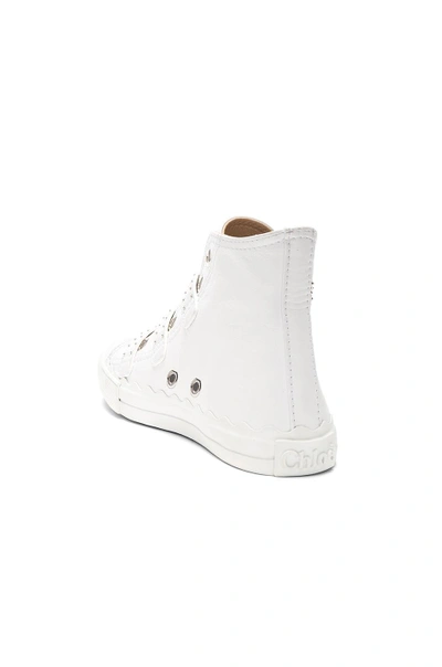 Shop Chloé Chloe Kyle Semi-shiny Calf Leather Buckle Sneakers In White