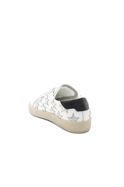 Shop Saint Laurent Star Leather Low Top Sneakers In White & Silver