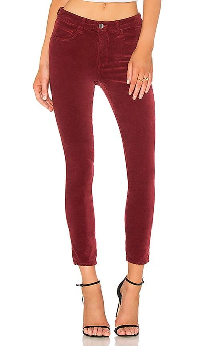 Shop L Agence Margot Skinny Velvet Pant In Red