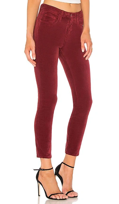 Shop L Agence Margot Skinny Velvet Pant In Red
