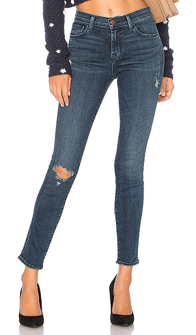 Shop J Brand 811 Mid Rise Skinny In Swift Destruct