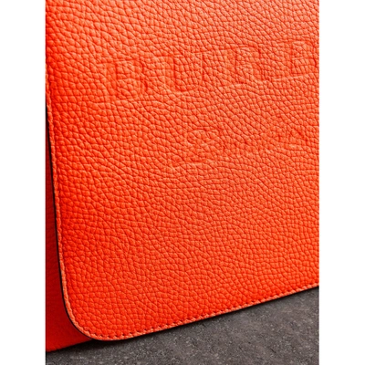 Shop Burberry Large Embossed Leather Messenger Bag In Neon Orange