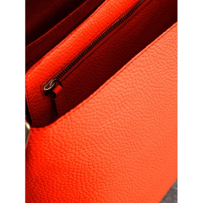 Shop Burberry Large Embossed Leather Messenger Bag In Neon Orange