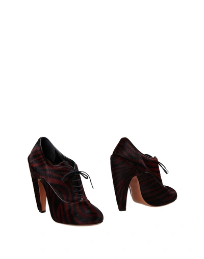 Shop Alaïa Ankle Boot In Maroon