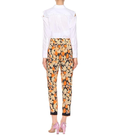 Shop Dries Van Noten Printed Silk Trousers In Orange