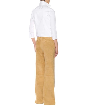 Shop The Row Flared Suede Trousers In Beige