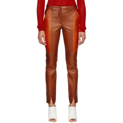 Shop Givenchy Orange Leather Trousers