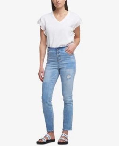 Shop Dkny Ripped Button-fly Skinny Jeans In Light Indigo