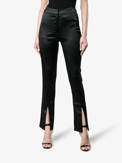 Shop Beaufille Lenea Satin Slim Leg Trousers In Black