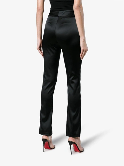 Shop Beaufille Lenea Satin Slim Leg Trousers In Black