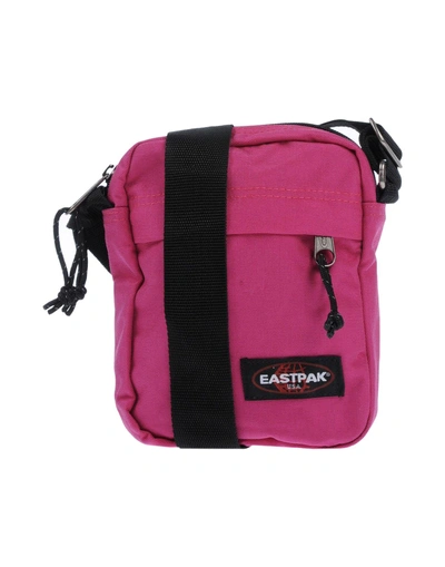 Shop Eastpak Handbags In Fuchsia