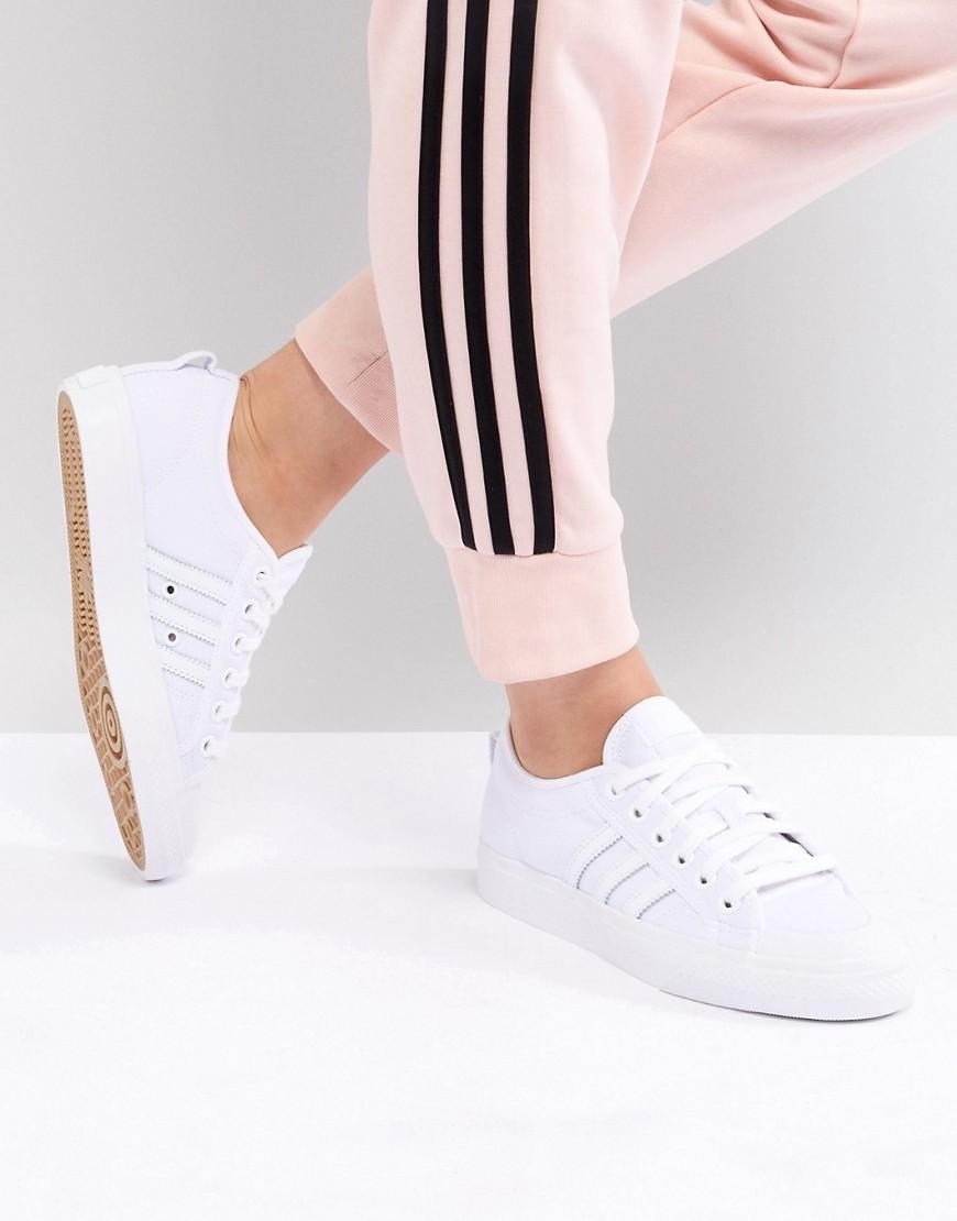 adidas originals nizza canvas sneakers in white and red