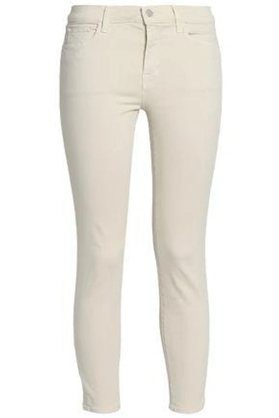 Shop J Brand Distressed Mid-rise Skinny Jeans In Beige