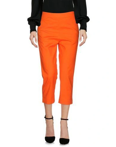 Shop Moschino Cropped Pants In Orange