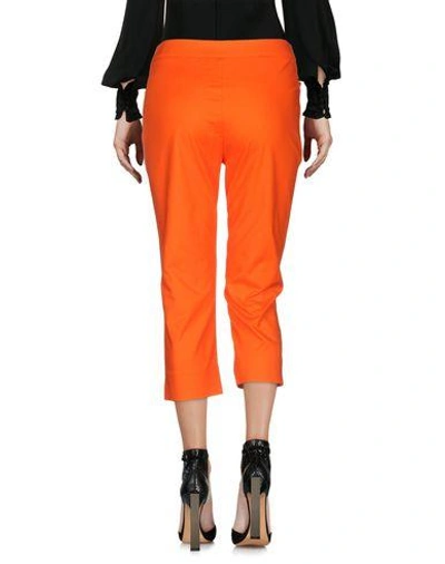 Shop Moschino Cropped Pants In Orange