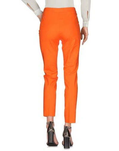 Shop Moschino Casual Pants In Orange