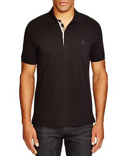 Shop Burberry Regular Fit Polo Shirt In Black