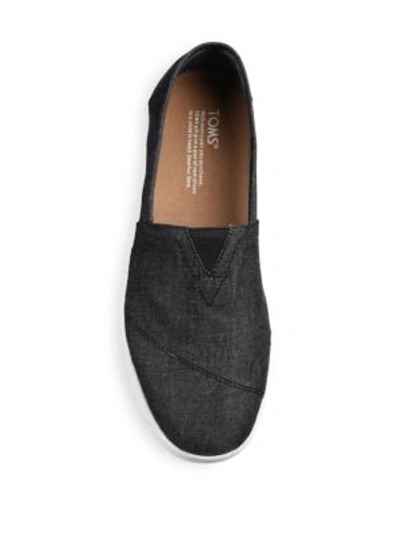 Shop Toms Avalon Chambray Slip-on Sneakers In Black