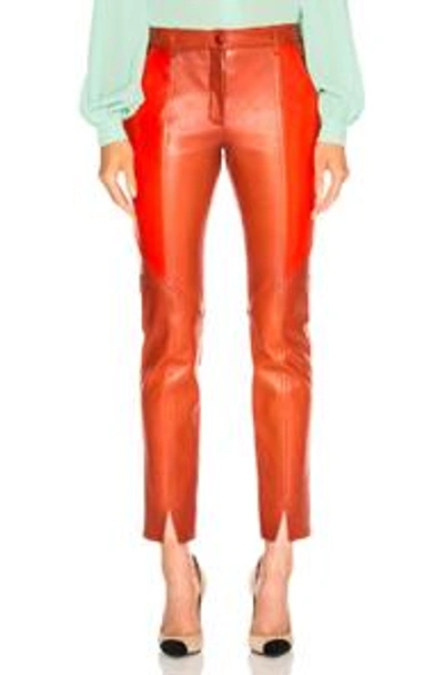 Shop Givenchy Paneled Leather Leggings In Orange