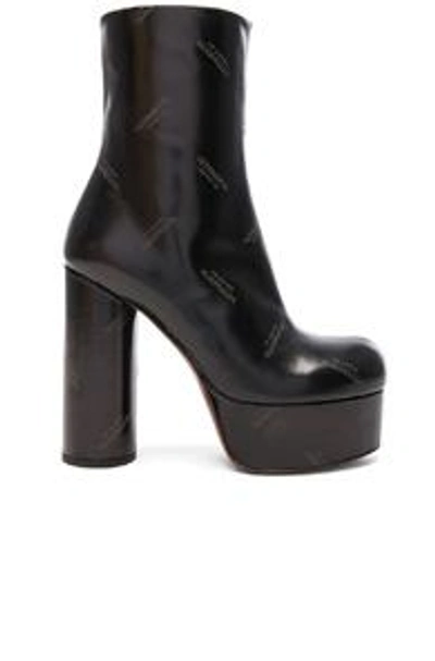 Shop Vetements Embossed Logo Leather Platform Boots In Black