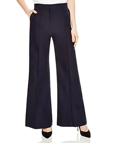 Shop Sandro Evania Flared Wide-leg Pants In Navy Blue
