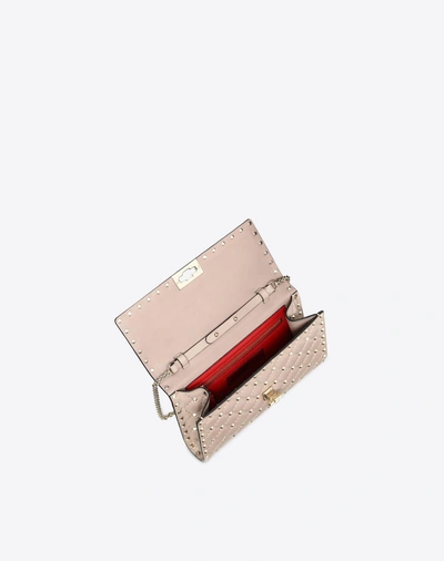 Shop Valentino Garavani Rockstud Spike Nappa Leather Crossbody Clutch Bag In Poudre