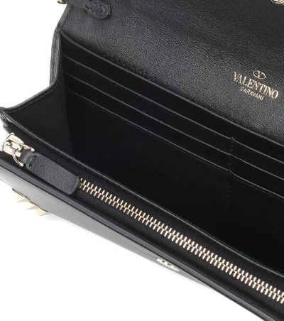 Shop Valentino Rockstud Leather Clutch In Black
