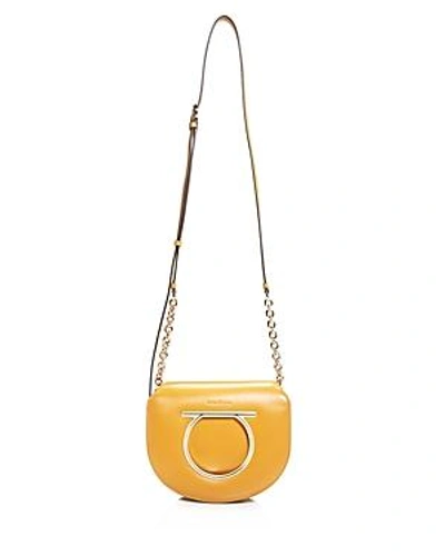 Shop Ferragamo Medium Vela Calfskin Shoulder Bag In Mustard Yellow/gold