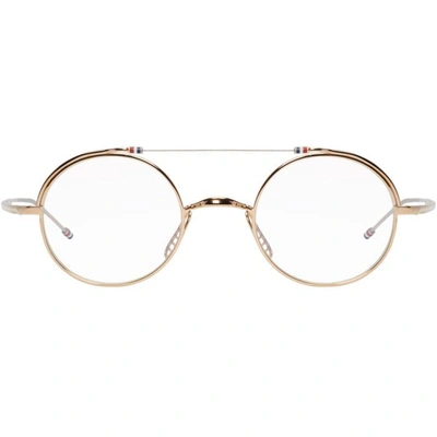 Shop Thom Browne Gold Tb-910 Glasses