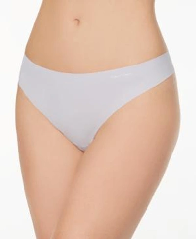 Shop Calvin Klein Invisibles Thong D3428 In Bliss
