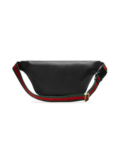 Shop Gucci Print Leather Belt Bag - Black