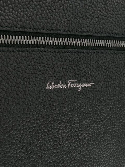 Shop Ferragamo Logo Zipped Messenger Bag In Black