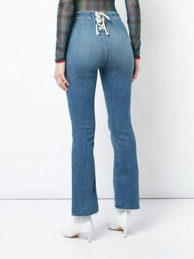 Shop Mother Back Tie Flared Jeans