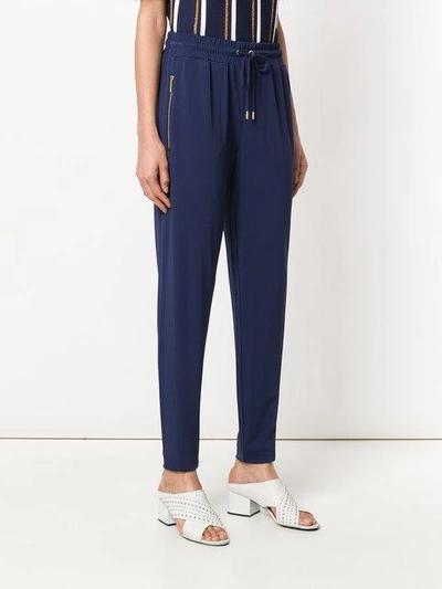 Shop Michael Michael Kors Tapered Jogger Trousers In Blue