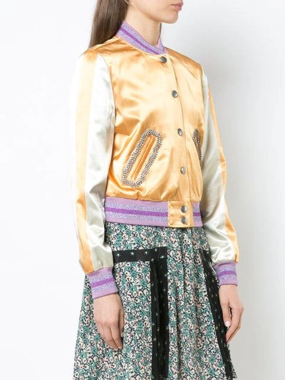 Shop Coach Satin Varsity Jacket - Unavailable In Dirty Gold