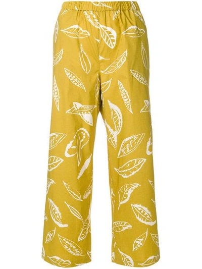 Shop Aspesi Leaf Print Trousers In Yellow