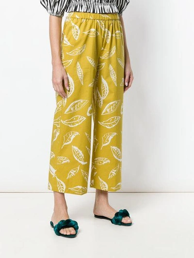 Shop Aspesi Leaf Print Trousers In Yellow