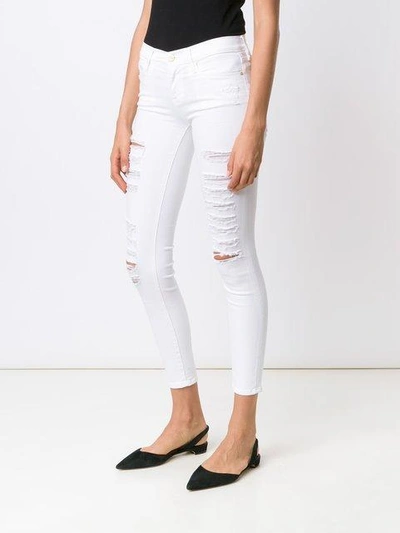 Shop Frame Distressed Skinny Cropped Jeans In White