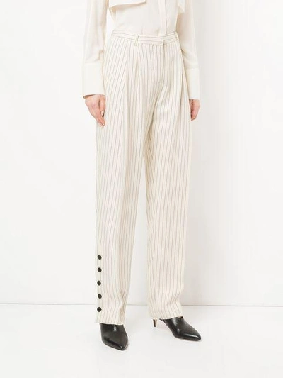 Shop Altuzarra Striped Button Cuff Trousers In White